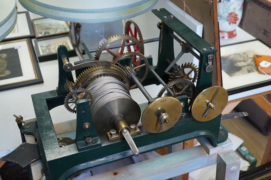 A late 19th century turret timepiece, understood to have been possibly built by Kemp of Bristol, green painted cast iron frame, with pendulum, weight, winding handle, and other unrestored parts, including the drive mecha